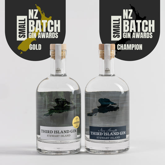 A bottle of Third Island Gin and Navy Strength Gin with awards on a white background
