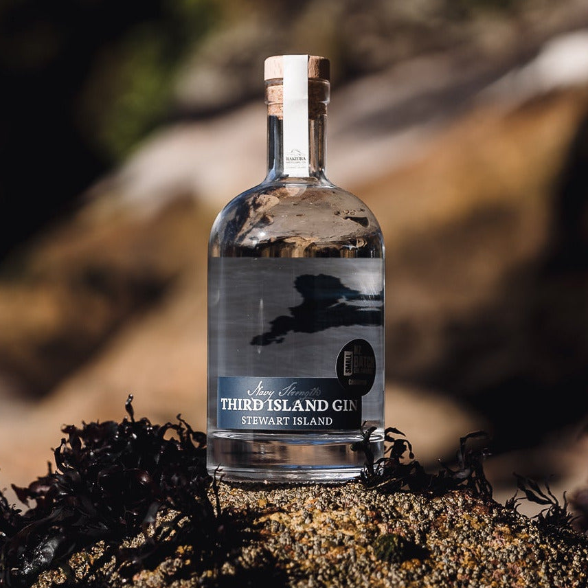 Bottle of Third Island Navy Strength Gin on a natural background