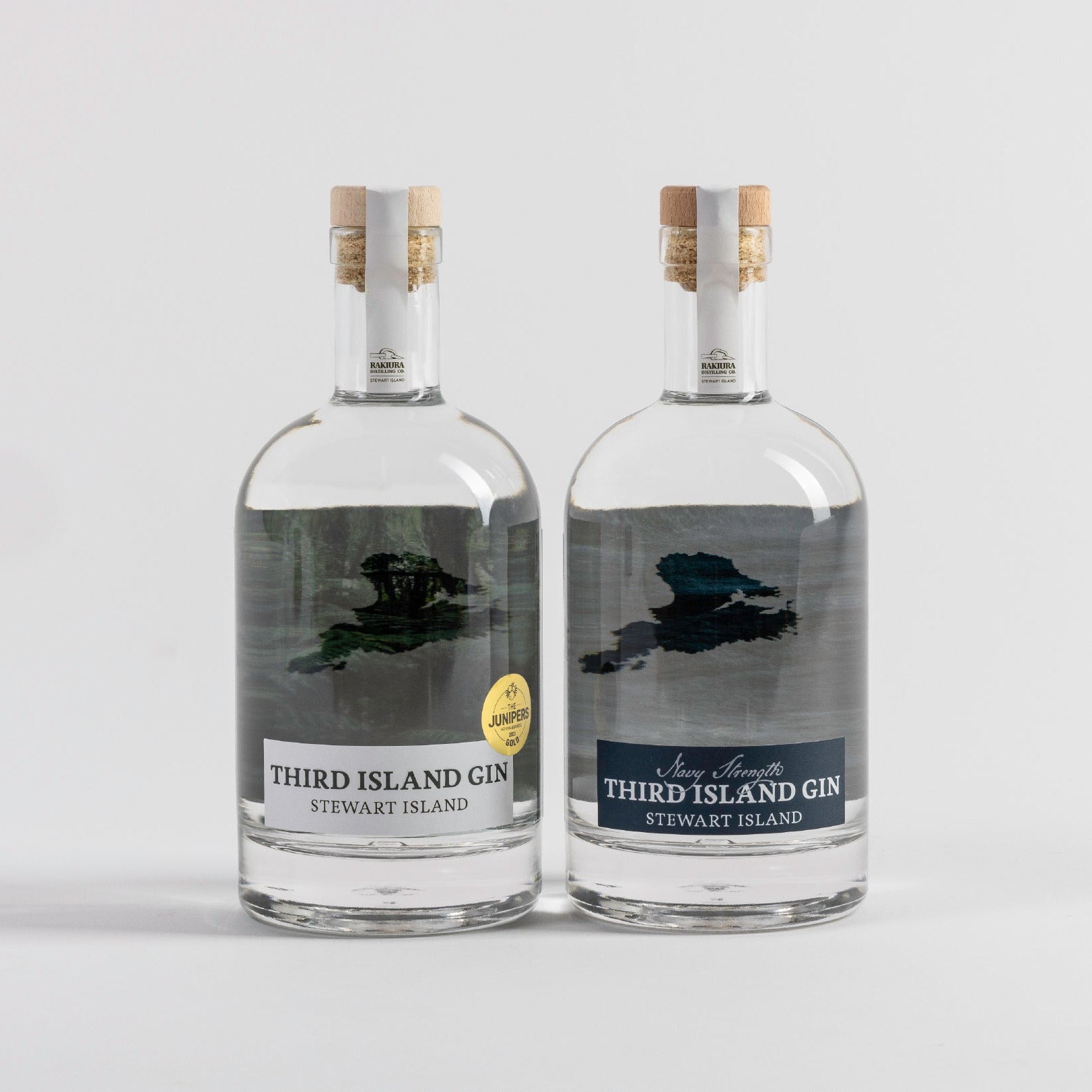 A bottle of Third Island Gin and Navy Strength Gin on a light gray background