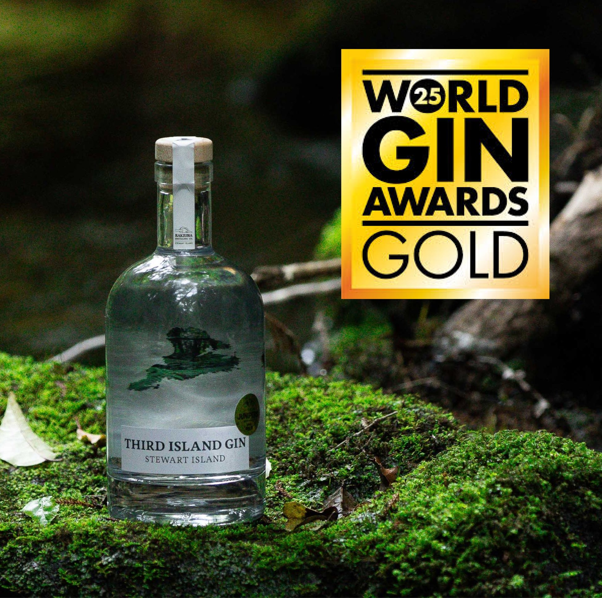 Bottle of Third Island Gin on a natural background with World Gin Awards Gold logo.