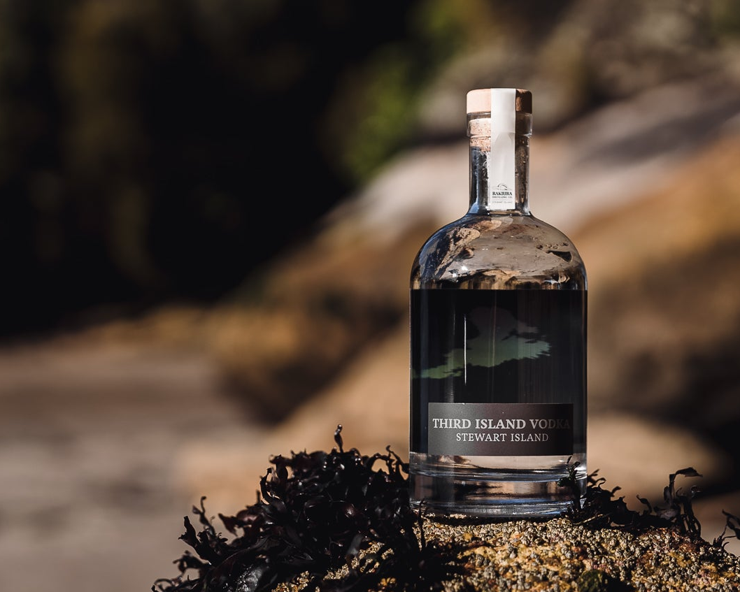 Bottle of Third Island Vodka on a natural background