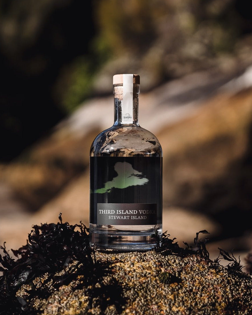 Bottle of Third Island Vodka on a natural background