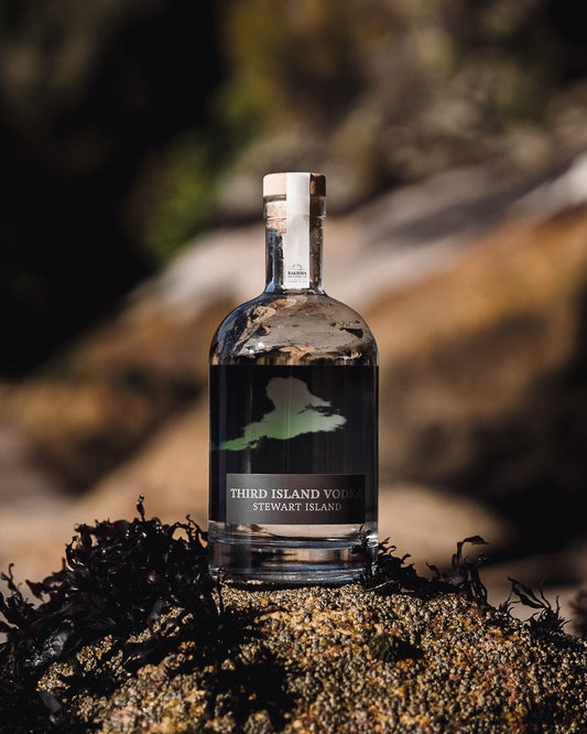 Bottle of Third Island Vodka on a natural background